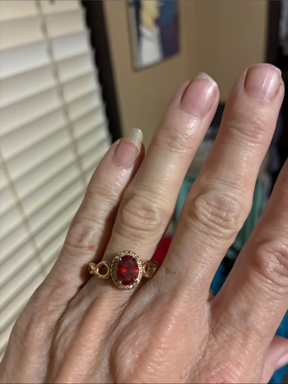 Gold Ring with Red Oval Gemstone